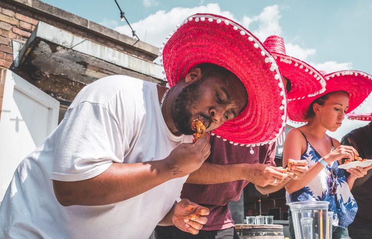 Visitors-enjoying-chicken-at-the-Roost-Chicken-Festival